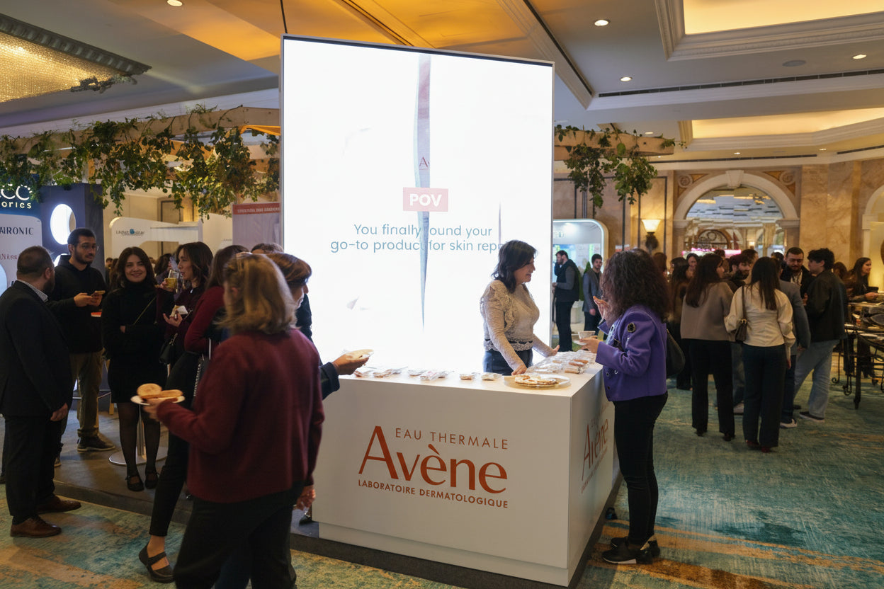 Event with people around Avene Booth