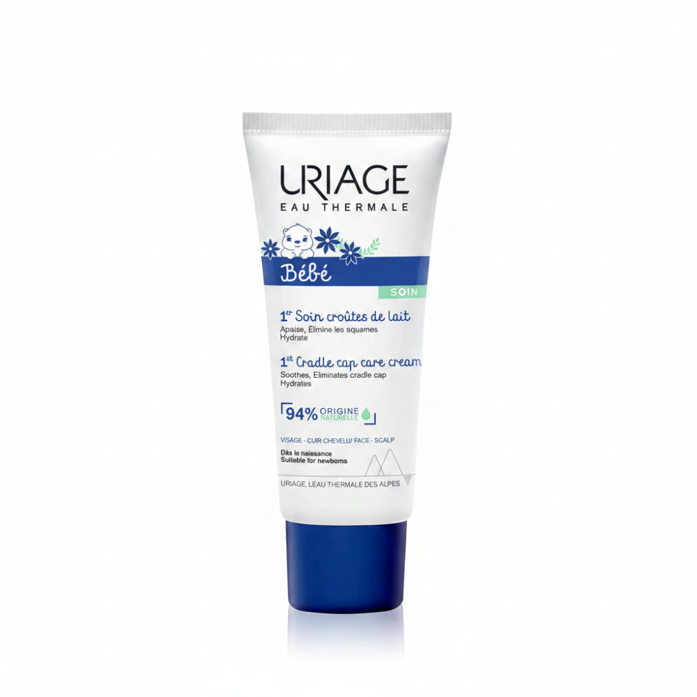 A tube of Uriage Eau Thermale Bébé baby scalp care cream, featuring a white tube with blue and black text and graphics, and a dark blue cap, set against a plain white background.