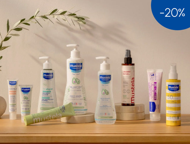 Mustela skincare products on a wooden surface with a discount label in the corner.