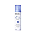 Uriage thermal water bottle with blue cap on a white background