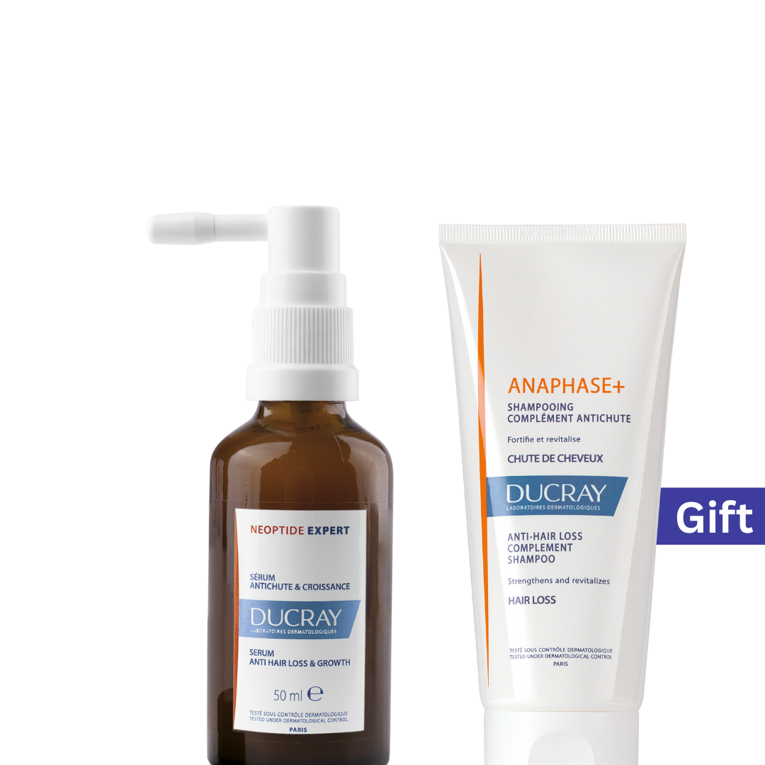 Ducray hair care products including a serum and shampoo on a white background