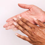 putting on hands Dermatologist-tested body exfoliator for sensitive skin