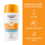 Eucerin sunscreen bottle with features listed on an orange background
