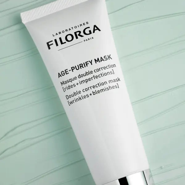 Filorga Age-Purify Mask tube on a light green textured background