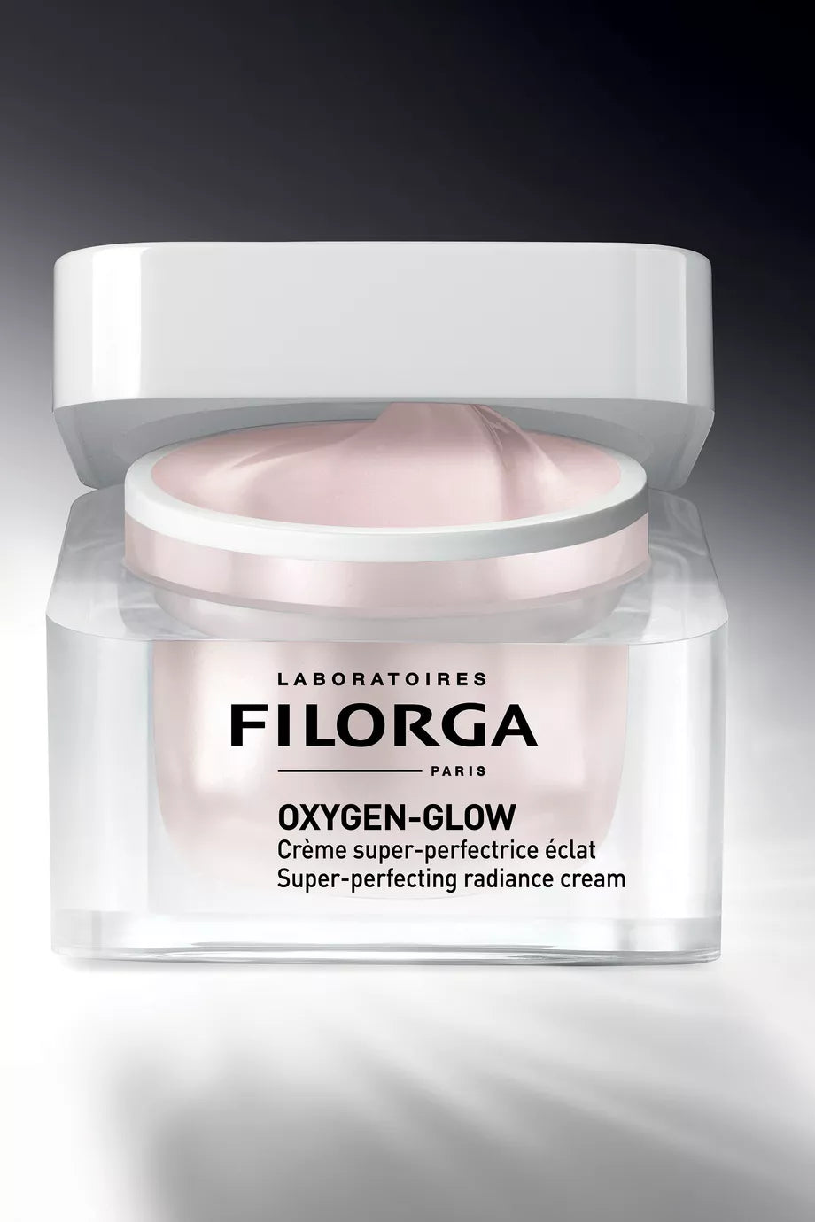 Filorga Oxygen-Glow cream jar on a dark background