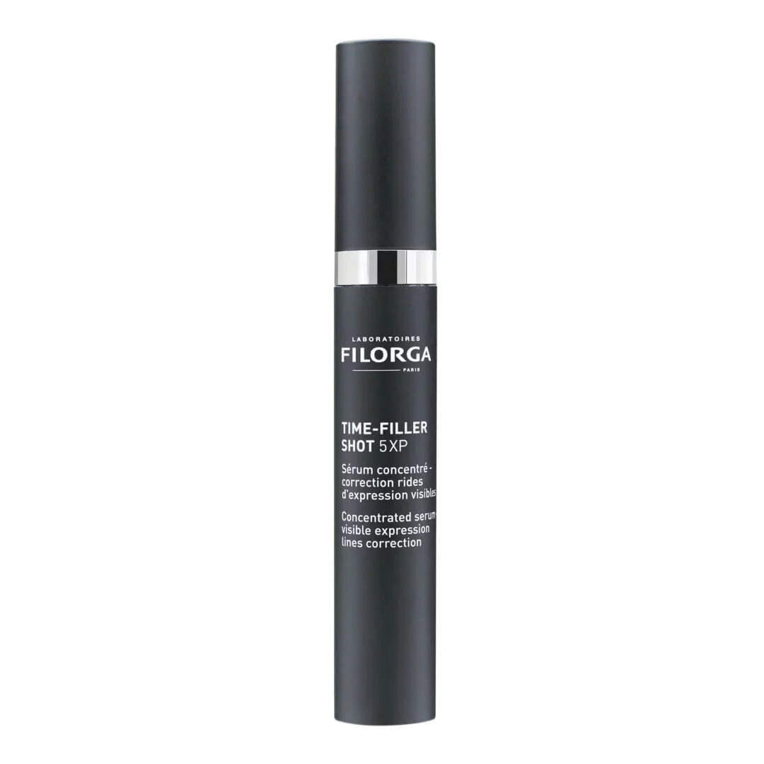 Black skincare serum bottle with visible branding on a white background