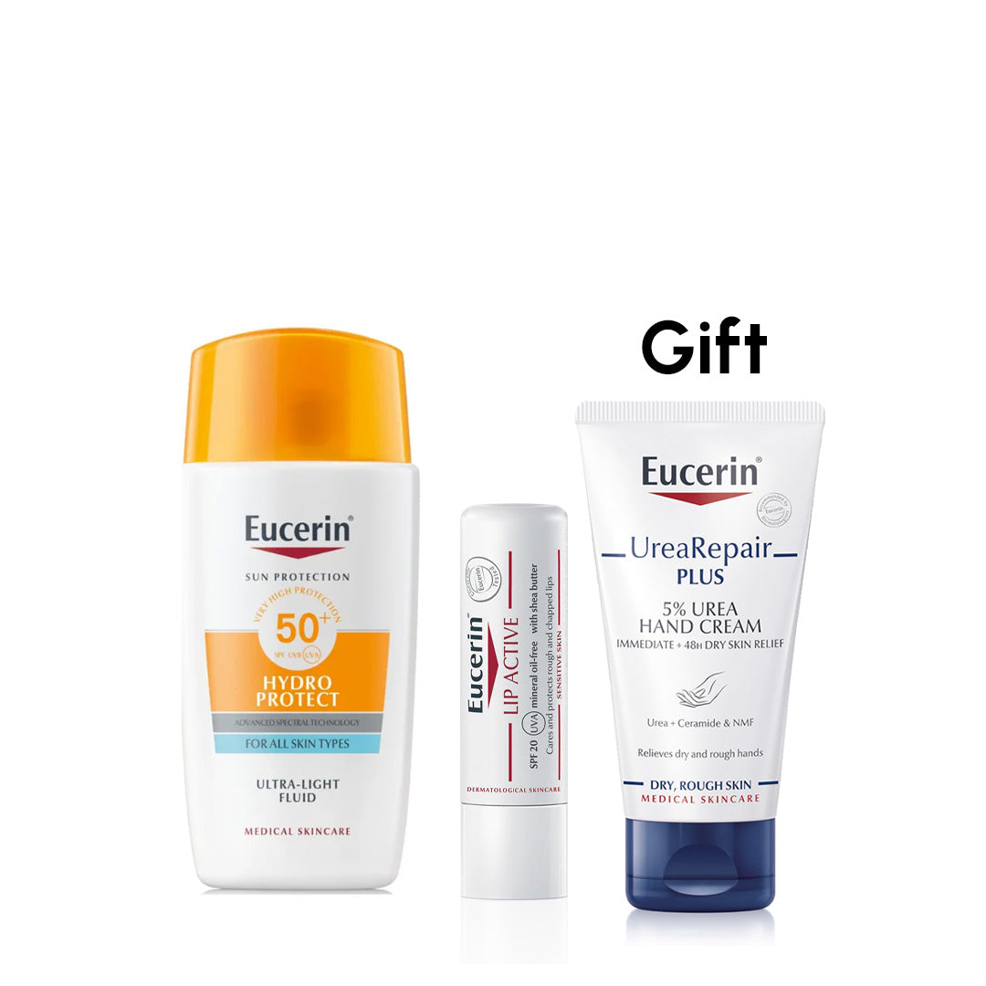Eucerin skincare products including a sun protection cream, lip balm, and hand cream on a white background.