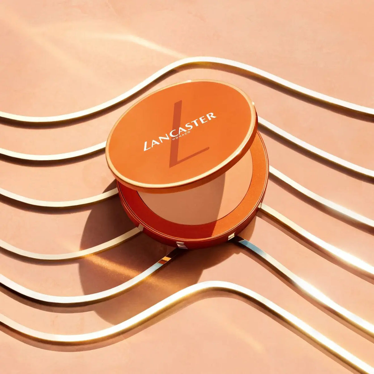 Lancaster makeup compact on a peach background