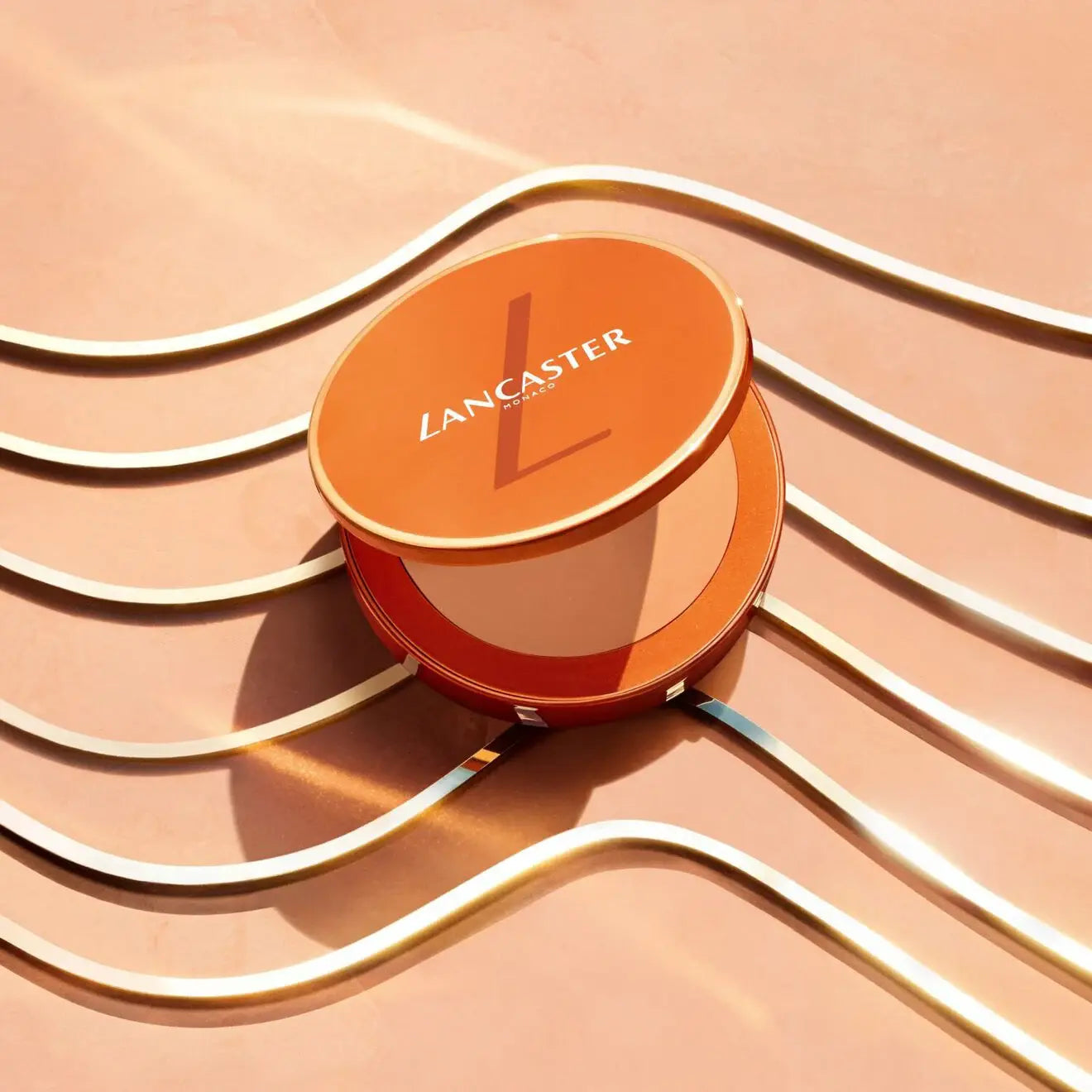 Lancaster makeup compact on a peach background