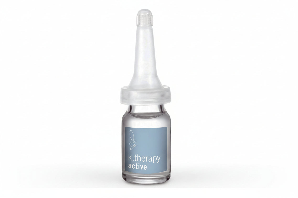 Glass dropper bottle labeled 'k. therapy active' on a white background