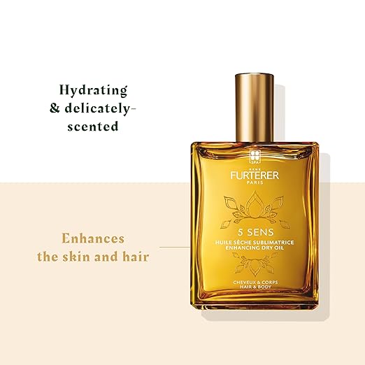 Gold bottle of Furterer hair and body oil on a beige background