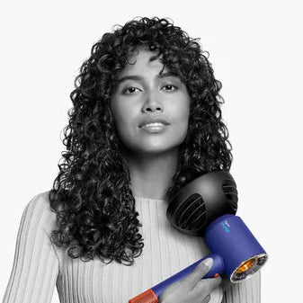 Dyson Wide-tooth comb attachment designed for textured curly and coily hair available at teh distriqt lebanon
