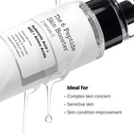 A close-up of a skincare serum bottle labeled 'The 6 Peptide Skin Booster' with a black pump and clear cap, shown on a white background with dripping liquid and marketing text.