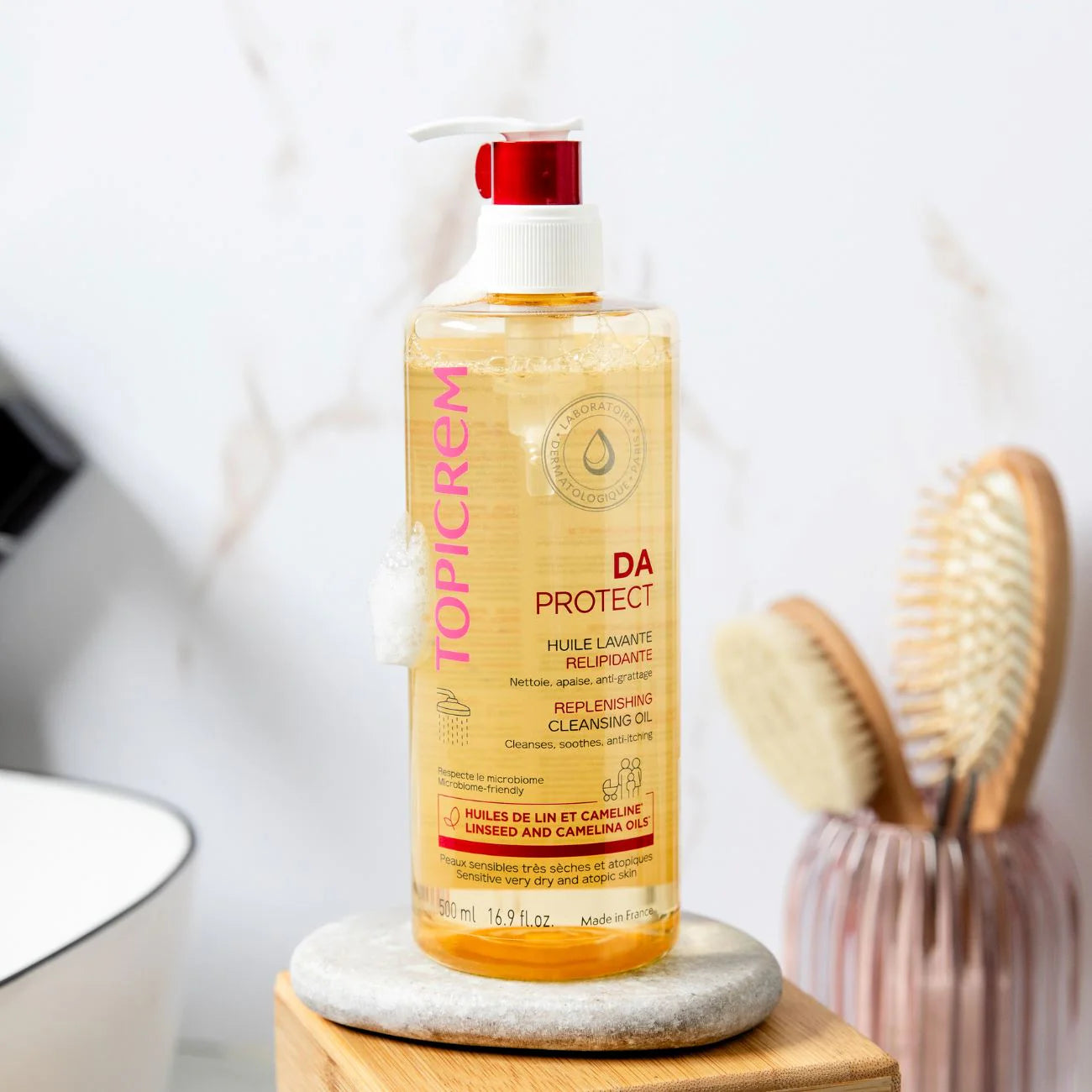 Topicrem cleansing oil for face, body, and scalp with skin barrier support.