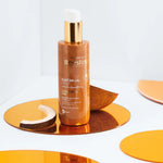Beesline natural tanning oil with gold shimmer, sweet almond oil, and vitamin E.