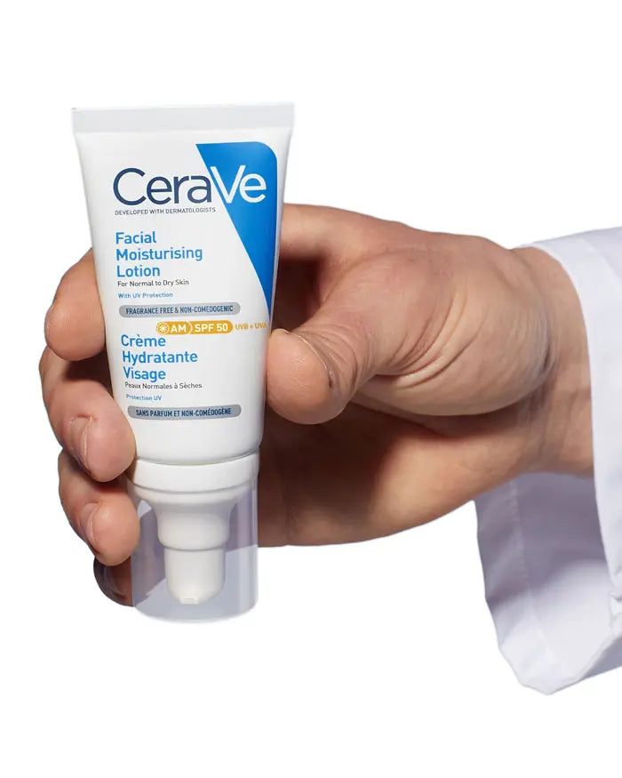CeraVe facial moisturizing lotion held in a hand against a white background