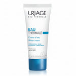 A white squeeze tube of Uriage Eau Thermale Water cream with a metallic blue cap, shown on a clean white background with a soft reflection.
