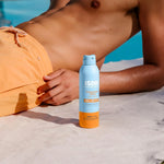 ISDIN SPF 50 sunscreen spray for wet and dry skin with transparent finish.