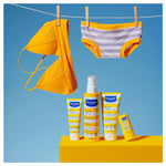 Mustela sunscreen products with yellow bikini and hat on a blue background