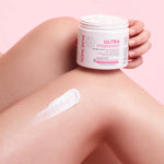 applying Topicrem body balm that nourishes and strengthens the skin barrier.