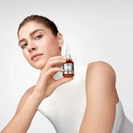 Applying Vichy Liftactiv Vitamin C 15% Serum to brighten skin and improve complexion radiance