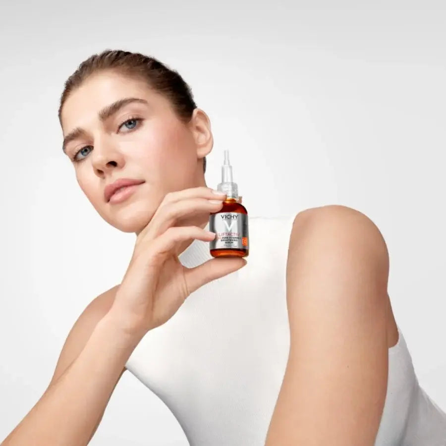Applying Vichy Liftactiv Vitamin C 15% Serum to brighten skin and improve complexion radiance