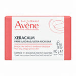 A 100g bar of Avène Xeracalm AD Pain Surgras Ultra-Rich Bar cleanser, shown in its original coral and white cardboard packaging against a plain white background.
